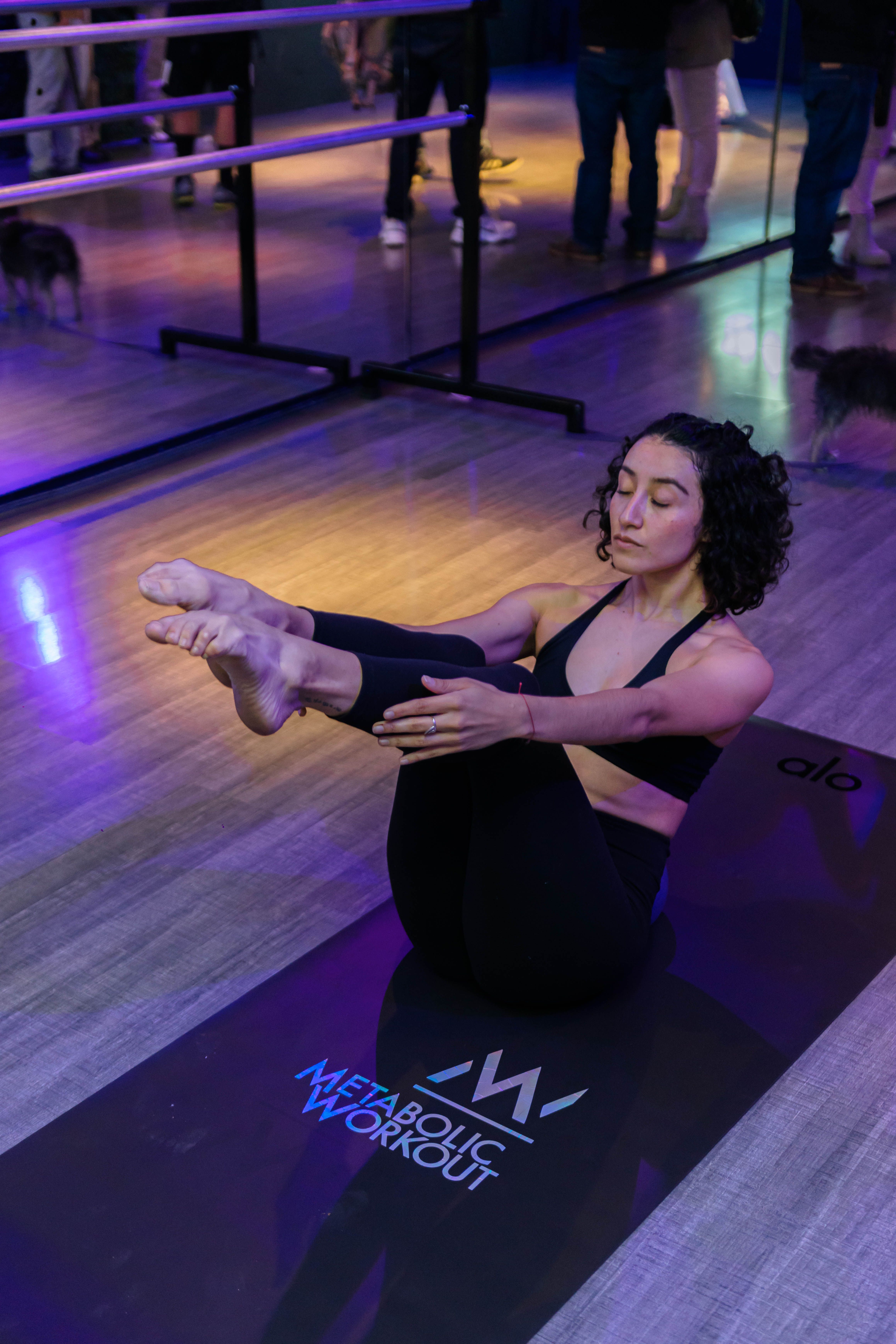 Yoga studio session with instructor and students